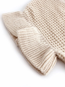 Short sleeve round neck waffle knit sweater in cream white with delicate ruffled hem