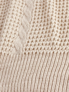 Women's short sleeve knit sweater with textured waffle knit and cable patterns in beige