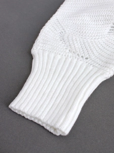Women's white knit sweater with hollow wave texture and ribbed cuffs for spring