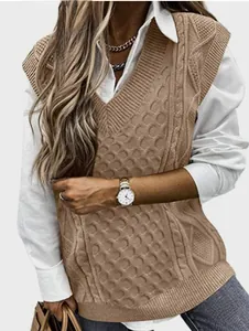 Close-up of khaki V-neck cable knit vest showing detailed texture and layering style