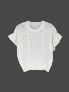 Close-up of white knit top featuring mesh hollow pattern and ruffled flutter sleeves