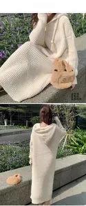 Front and back view of a beige long-sleeve hooded knit dress in a cozy outdoor garden setting