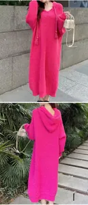 Detail of hot pink hooded knit dress showing thick drawstring and ribbed texture details