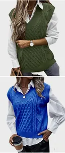 Detail of V-neck cable knit vest showing green and blue textured stitch patterns