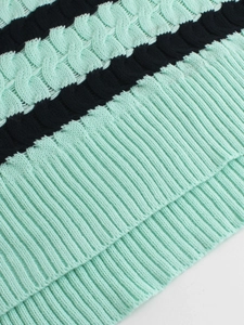 Women's knit crewneck sweater featuring mint green cables and dark blue ribbed stripes