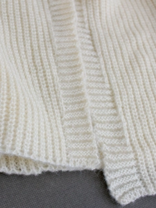 Cream white knitted long sleeve V-neck dress with thick ribbed texture for autumn winter