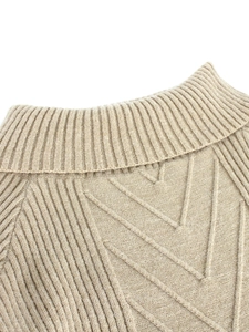 Oatmeal knit sweater for women featuring a ribbed turtleneck and V-shaped texture detail