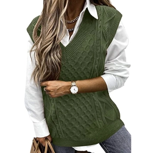 Oversized V-neck cable knit sweater vest for women in olive green layered over white shirt