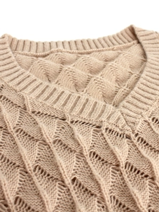 Beige V-neck pullover sweater featuring intricate diamond knit texture and soft fibers