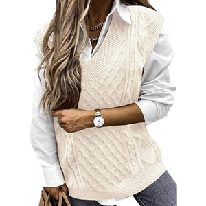Chic oversized V-neck cable knit sweater vest in beige for women layered over a white shirt