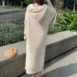 Chic cream hooded knit dress with long sleeves and ribbed texture in a longline silhouette