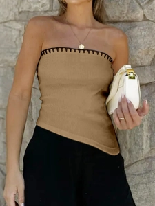 Detail of khaki ribbed knit tube top featuring black scalloped trim and asymmetric hem