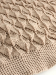 Women's V-neck pullover sweater in apricot knit with detailed wave texture and ribbed cuffs
