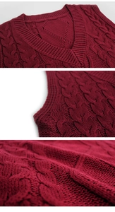Detailed view of burgundy cable knit vest showing V-neck and ribbed fabric texture