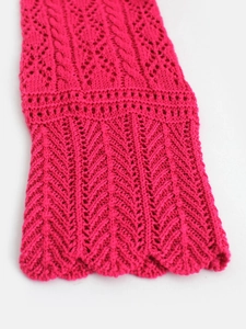 Short knit cardigan with hollow weave pattern and scalloped edges in vibrant fuchsia