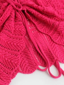 Short bright pink crochet knit cardigan with hollow wave pattern and front tie string