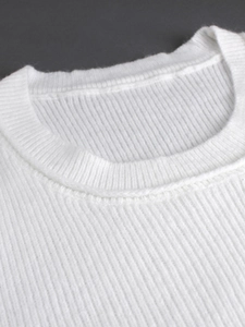 White crewneck knit sweater featuring vertical ribbed texture and elastic neckline detail