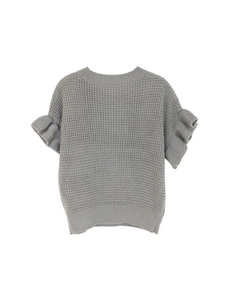 Close-up detail of grey short sleeve knit sweater with ruffle cuffs and waffle texture