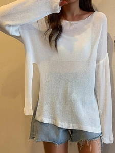 Women's white long sleeve lightweight knit top with a semi-sheer texture and loose fit