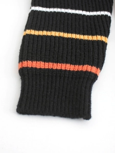 Women's long sleeve striped knit cardigan featuring ribbed cuffs with white and orange stripes