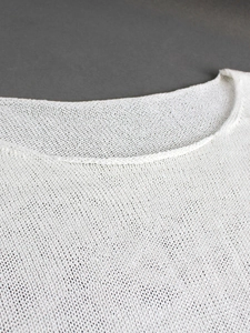 Women's white lightweight knit sweater top featuring mesh texture and a boat neckline