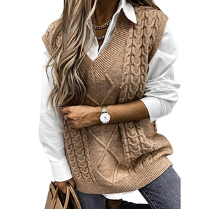 Classic brown V-neck cable knit sweater vest for women styled with a white long sleeve shirt