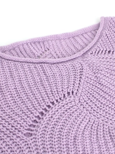 Detail view of purple knit sweater featuring intricate hollow lace patterns and thick yarn texture