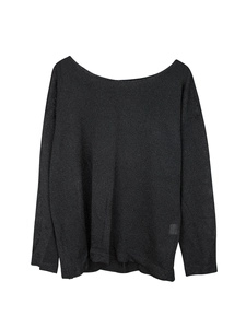 Detailed texture of thin dark grey boat neck knitted sweater for women in spring