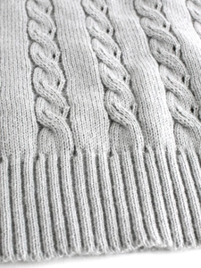 Women's light grey cable knit sleeveless sweater with ribbed hem detail for winter