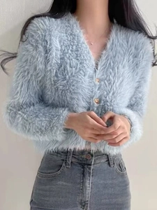 Women's light blue V-neck knit cardigan with heart buttons and fuzzy plush texture