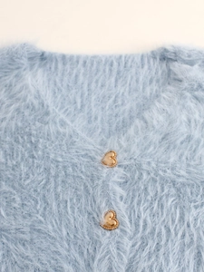 Women's light blue V-neck fuzzy cardigan featuring elegant gold heart-shaped buttons