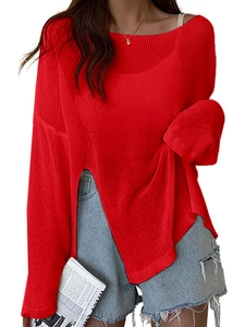 Detail of red loose-fit knit sweater featuring high side slits and long drop shoulder sleeves