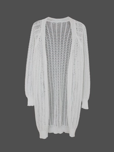Detail of white hollow crochet knit cardigan with intricate semi-transparent texture