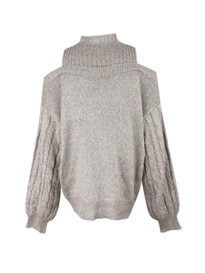 Detail of oatmeal knit sweater featuring cold shoulder cutouts and cable knit sleeves
