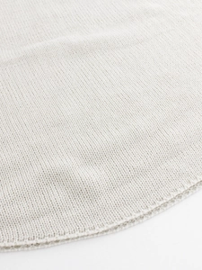 Women's cream oversized batwing sleeve sweater featuring a minimalist knit hem design