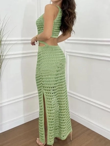 Knitted green two-piece set featuring a cropped tank top and side-slit maxi skirt