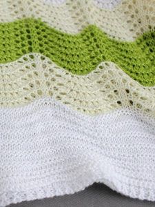 Women's knit vest with hollow wave patterns in white, beige, and emerald green stripes