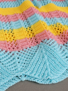 Women's crochet hollow beach skirt with colorful wave patterns in pink yellow and blue