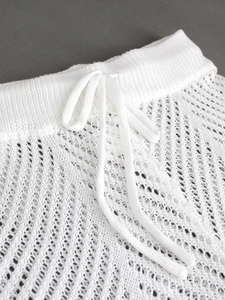 White knit hollow-out beach pants with drawstring waist detail and mesh texture