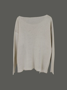Detail of light grey oversized boat neck sweater with fine knit texture on grey background