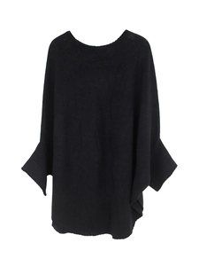 Close-up of the black knitted batwing sleeve sweater showing fabric texture and round neck