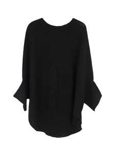 Close-up of black oversized knit sweater with batwing sleeves and textured fabric detail
