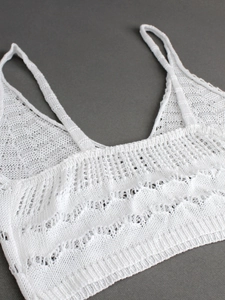 White knit crochet camisole vest featuring wavy hollow texture and delicate shoulder straps