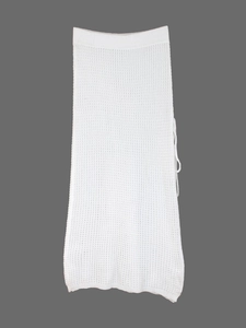 Elegant white knitted beach maxi dress with openwork crochet texture for summer holidays