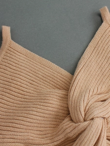 Detailed view of camel twist knot camisole featuring premium ribbed knit fabric texture