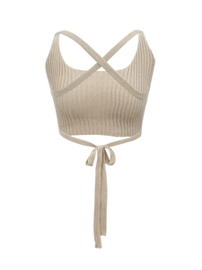 Beige ribbed knit crop top featuring cross halter straps and waist tie detail