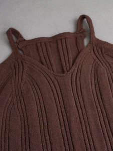 Detailed macro view of the dark brown ribbed knit fabric on a slim-fit camisole top