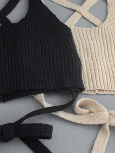 Two-piece ribbed knit cross halter crop tops in black and beige with waist tie details
