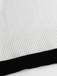 Women's knit two-piece set featuring black and white contrast ribbed hem detail