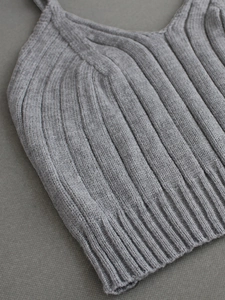 Detail shot of grey ribbed knit V-neck camisole with thin shoulder straps